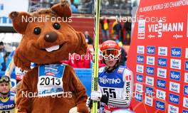 28.02.2013, Val di Fiemme, Italy (ITA): (l-r) the mascot Skiri and Eric Frenzel (GER), Fischer, Leki, Salomon, Adidas  - FIS nordic world ski championships, nordic combined, individual gundersen HS134/10km, Val di Fiemme (ITA). www.nordicfocus.com. © Laiho/NordicFocus. Every downloaded picture is fee-liable.