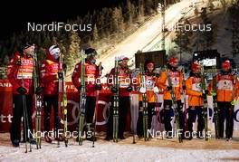 01.12.2013, Kuusamo, Finland (FIN): Team Norway and Team Germany wait for the flower ceremony - FIS world cup nordic combined, team HS142/4x5km, Kuusamo (FIN). www.nordicfocus.com. © Felgenhauer/NordicFocus. Every downloaded picture is fee-liable.