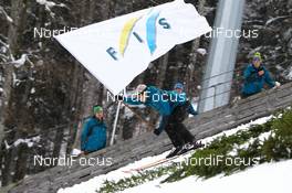 16.02.2013, Oberstdorf, Germany (GER): the flag of FIS will be brought to the stadium  - FIS world cup ski flying, individual HS213, Oberstdorf (GER). www.nordicfocus.com. © Laiho/NordicFocus. Every downloaded picture is fee-liable.