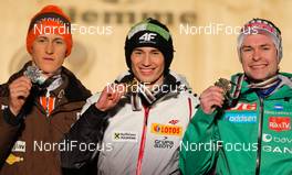 01.03.2013, Val di Fiemme, Italy (ITA):  (l-r) Peter Prevc (SLO), Kamil Stoch (POL), Fischer and Anders Jacobsen (NOR), Fluege.de - FIS nordic world ski championships, ski jumping, individual HS134, Val di Fiemme (ITA). www.nordicfocus.com. © Laiho/NordicFocus. Every downloaded picture is fee-liable.