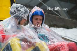 20.12.2013, Engelberg, Switzerland (SUI): Event Feature: Prejumpers in rain covers - FIS world cup ski jumping, training, Engelberg (SUI). www.nordicfocus.com. © Manzoni/NordicFocus. Every downloaded picture is fee-liable.