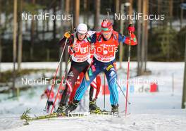 16.03.2014, Kontiolahti, Finland (FIN): Dmitry Malyshko (RUS), Fischer, Rottefella, Alpina, Leki, adidas followed by Simon Eder (AUT), Fischer, Rottefella, Swix - IBU world cup biathlon, pursuit men, Kontiolahti (FIN). www.nordicfocus.com. © Laiho/NordicFocus. Every downloaded picture is fee-liable.