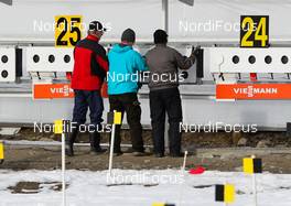 14.03.2014, Kontiolahti, Finland (FIN): volunteers changing the targets - IBU world cup biathlon, training, Kontiolahti (FIN). www.nordicfocus.com. © Laiho/NordicFocus. Every downloaded picture is fee-liable.