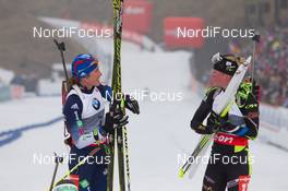 22.03.2014, Oslo, Norway (NOR): Susan Dunklee (USA), Marie Dorin (FRA) - IBU world cup biathlon Holmenkollen, pursuit women, Oslo (NOR). www.nordicfocus.com. © Manzoni/NordicFocus. Every downloaded picture is fee-liable.