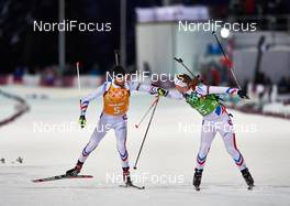19.02.2014, Sochi, Russia (RUS): Jean Guillaume Beatrix (FRA), Anais Bescond (FRA), (l-r) - XXII. Olympic Winter Games Sochi 2014, biathlon, relay mixed, Sochi (RUS). www.nordicfocus.com. © NordicFocus. Every downloaded picture is fee-liable.