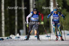 03.12.2014, Oestersund, Sweden (SWE):  Brendan Green (CAN), Christoffer Eriksson (SWE) - IBU world cup biathlon, individual men, Oestersund (SWE). www.nordicfocus.com. © Manzoni/NordicFocus. Every downloaded picture is fee-liable.