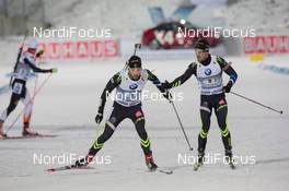 30.11.2014, Oestersund, Sweden (SWE):  Martin Fourcade (FRA), Simon Fourcade (FRA) - IBU world cup biathlon, relay mixed, Oestersund (SWE). www.nordicfocus.com. © Manzoni/NordicFocus. Every downloaded picture is fee-liable.