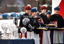 16.03.2014, Falun, Sweden (SWE): trophies and trophy girls ready for the ceremony - FIS world cup cross-country, 15km men handicap start, Falun (SWE). www.nordicfocus.com. © Felgenhauer/NordicFocus. Every downloaded picture is fee-liable.