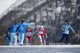 22.02.2014, Sochi, Russia (RUS): Therese Johaug (NOR), Kristin Stoermer Steira (NOR) at the food station - XXII. Olympic Winter Games Sochi 2014, cross-country, 30km women, Sochi (RUS). www.nordicfocus.com. © NordicFocus. Every downloaded picture is fee-liable.