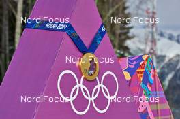 10.02.2014, Sochi, Russia (RUS): gold medal - XXII. Olympic Winter Games Sochi 2014, cross-country, medals, Sochi (RUS). www.nordicfocus.com. © NordicFocus. Every downloaded picture is fee-liable.