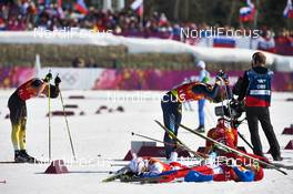 16.02.2014, Sochi, Russia (RUS): exhausted athletes in the handover zone - XXII. Olympic Winter Games Sochi 2014, cross-country, 4x10km men, Sochi (RUS). www.nordicfocus.com. © NordicFocus. Every downloaded picture is fee-liable.