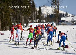 16.02.2014, Sochi, Russia (RUS): athletes approach the first uphill - XXII. Olympic Winter Games Sochi 2014, cross-country, 4x10km men, Sochi (RUS). www.nordicfocus.com. © NordicFocus. Every downloaded picture is fee-liable.
