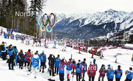 09.02.2014, Sochi, Russia (RUS): the first group passes coaches and the olympic rings - XXII. Olympic Winter Games Sochi 2014, cross-country, skiathlon men, Sochi (RUS). www.nordicfocus.com. © NordicFocus. Every downloaded picture is fee-liable.