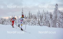 30.11.2014, Ruka, Finland (FIN): Ivan Babikov (CAN), Salomon, One Way followed by Dietmar Noeckler (ITA), Fischer, KV+, Rottefella - FIS world cup cross-country, 15km men, Ruka (FIN). www.nordicfocus.com. © Laiho/NordicFocus. Every downloaded picture is fee-liable.