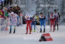 29.11.2014, Ruka, Finland (FIN): (l-r) Teodor Peterson (SWE), Rossignol, Skigo, Rottefella, Craft, Eirik Brandsdal (NOR), Fischer, Alpina, Rottefella and Matias Strandvall (FIN), Fischer, Swix, Salomon - FIS world cup cross-country, individual sprint, Ruka (FIN). www.nordicfocus.com. © Laiho/NordicFocus. Every downloaded picture is fee-liable.