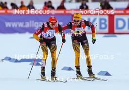 25.01.2014, Oberstdorf, Germany (GER): (l-r) Eric Frenzel (GER), Fischer, Leki, Salomon, Adidas and Fabian Riessle (GER), Fischer, One Way, Rottefella, Adidas - FIS world cup nordic combined, team HS137/4x5km, Oberstdorf (GER). www.nordicfocus.com. © Laiho/NordicFocus. Every downloaded picture is fee-liable.