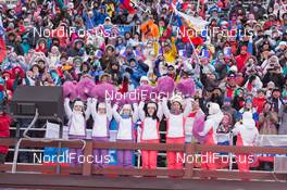21.03.2015, Khanty-Mansiysk, Russia (RUS): Event Feature: Fans with cheerleaders on the grand stand - IBU world cup biathlon, pursuit men, Khanty-Mansiysk (RUS). www.nordicfocus.com. © Manzoni/NordicFocus. Every downloaded picture is fee-liable.