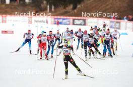 08.01.2015, Cortina-Toblach, Italy (ITA): Celia Aymonier (FRA),  leads ahead of the wave start - FIS world cup cross-country, tour de ski, pursuit women, Cortina-Toblach (ITA). www.nordicfocus.com. © Felgenhauer/NordicFocus. Every downloaded picture is fee-liable.