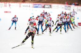 08.01.2015, Cortina-Toblach, Italy (ITA): Celia Aymonier (FRA),  leads ahead of the wave start - FIS world cup cross-country, tour de ski, pursuit women, Cortina-Toblach (ITA). www.nordicfocus.com. © Felgenhauer/NordicFocus. Every downloaded picture is fee-liable.