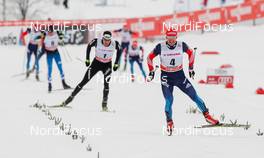 25.01.2015, Rybinsk, Russia (RUS): Maxim Vylegzhanin (RUS), Fischer, Swix, Alpina, Rottefella, Adidas followed by Dario Cologna (SUI), Fischer, One Way, Rottefella, Odlo and Matti Heikkinen (FIN), Salomon, One Way - FIS world cup cross-country, skiathlon men, Rybinsk (RUS). www.nordicfocus.com. © Laiho/NordicFocus. Every downloaded picture is fee-liable.