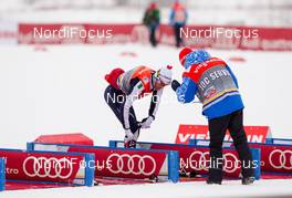 25.01.2015, Rybinsk, Russia (RUS): Roland Clara (ITA), Fischer, Swix, Rottefella bringing skis and poles to the ski changing area before the race - FIS world cup cross-country, skiathlon men, Rybinsk (RUS). www.nordicfocus.com. © Laiho/NordicFocus. Every downloaded picture is fee-liable.