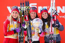 15.03.2015, Oslo, Norway (NOR): the overall world cup (l-r) Therese Johaug (NOR), Fischer, Swix, Rottefella, Marit Bjoergen (NOR), Fischer, Swix, Rottefella and Heidi Weng (NOR), Madshus, Swix, Rottefella - FIS world cup cross-country, mass women, Oslo (NOR). www.nordicfocus.com. © Laiho/NordicFocus. Every downloaded picture is fee-liable.