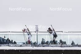 03.03.2016, Oslo, Norway (NOR): Lukasz Szczurek (POL), Benjamin Weger (SUI), (l-r) - IBU world championships biathlon, relay mixed, Oslo (NOR). www.nordicfocus.com. © Manzoni/NordicFocus. Every downloaded picture is fee-liable.