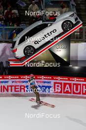 29.12.2015, Oberstdorf, Germany (GER): Michael Neumayer (GER) in front of a sponsor car - FIS world cup ski jumping, four hills tournament, individual HS137, Oberstdorf (GER). www.nordicfocus.com. © Laiho/NordicFocus. Every downloaded picture is fee-liable.