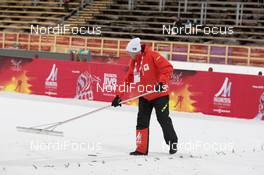 19.02.2015, Falun, Sweden (SWE): Volunteer cleans the outrun  - FIS nordic world ski championships, ski jumping ladies, training, Falun (SWE). www.nordicfocus.com. © NordicFocus. Every downloaded picture is fee-liable.