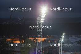 19.02.2015, Falun, Sweden (SWE): Light towers with the WM village and Falun Cinty in the back - FIS nordic world ski championships, ski jumping ladies, training, Falun (SWE). www.nordicfocus.com. © NordicFocus. Every downloaded picture is fee-liable.