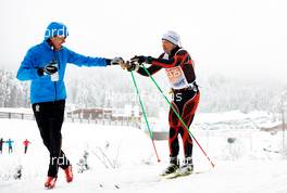 17.01.2015, Lienz, Austria (AUT): slower racers getting drinks - FIS Marathon Cup Dolomitenlauf Classic, Lienz (AUT). www.nordicfocus.com. © Felgenhauer/NordicFocus. Every downloaded picture is fee-liable.