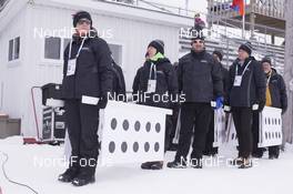 10.02.2016, Presque Isle, United States of America (USA): Event Feature: Range marshalls carry paper targets -  IBU world cup biathlon, training, Presque Isle (USA). www.nordicfocus.com. © Manzoni/NordicFocus. Every downloaded picture is fee-liable.