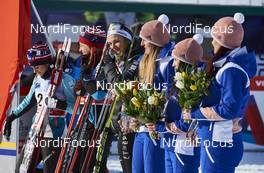 16.01.2016, Planica, Slovenia (SLO): Astrid Uhrenholdt Jacobsen (NOR), Stina Nilsson (SWE), Heidi Weng (NOR), (l-r),  and flower girls - FIS world cup cross-country, individual sprint, Planica (SLO). www.nordicfocus.com. © Felgenhauer/NordicFocus. Every downloaded picture is fee-liable.