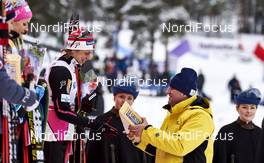 14.02.2016, Falun, Sweden (SWE): Astrid Uhrenholdt Jacobsen (NOR), gets Le Gruyere cheese   - FIS world cup cross-country, mass women, Falun (SWE). www.nordicfocus.com. © Felgenhauer/NordicFocus. Every downloaded picture is fee-liable.