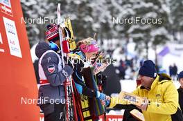 14.02.2016, Falun, Sweden (SWE): Therese Johaug (NOR) gets Le Gruyere cheese - FIS world cup cross-country, mass women, Falun (SWE). www.nordicfocus.com. © Felgenhauer/NordicFocus. Every downloaded picture is fee-liable.
