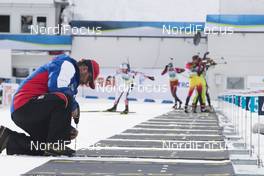 28.01.2018, Ridnaun, Italy (ITA): Event Feature: Range staff repairs the shooting mats while undefined athletes compete - IBU Open European championships biathlon, single mixed relay, Ridnaun (ITA). www.nordicfocus.com. © Manzoni/NordicFocus. Every downloaded picture is fee-liable.