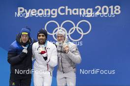 13.02.2018, Pyeongchang, Korea (KOR): Sebastian Samuelsson (SWE), Martin Fourcade (FRA), Benedikt Doll (GER), (l-r) - XXIII. Olympic Winter Games Pyeongchang 2018, biathlon, medals, Pyeongchang (KOR). www.nordicfocus.com. © Manzoni/NordicFocus. Every downloaded picture is fee-liable.