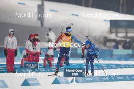 23.02.2018, Pyeongchang, Korea (KOR): Martin Fourcade (FRA), Antonin Guigonnat (FRA), (l-r) - XXIII. Olympic Winter Games Pyeongchang 2018, biathlon, relay men, Pyeongchang (KOR). www.nordicfocus.com. © Manzoni/NordicFocus. Every downloaded picture is fee-liable.
