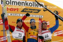 26.03.2006, Holmenkollen, Norway (NOR) Roman Dostal (CZE), Ole Einar Bjoerndalen (NOR), Sergei Rozhkov (RUS), (l-r) - IBU World Cup Biathlon, mass start men, Holmenkollen (NOR). www.nordicfocus.com. © Manzoni/NordicFocus. Every downloaded picture is fee-liable.