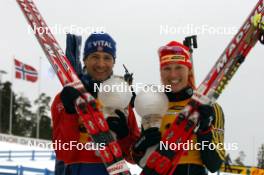 26.03.2006, Holmenkollen, Norway (NOR) Ole Einar Bjoerndalen (NOR), Kati Wilhelm (GER), (l-r) - IBU World Cup Biathlon, mass start men, Holmenkollen (NOR). www.nordicfocus.com. © Manzoni/NordicFocus. Every downloaded picture is fee-liable.