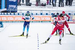 01.03.2020, Lahti Finland (FIN): Roman Furger (SUI), Johannes Hoesflot Klaebo (NOR), (l-r)  - FIS world cup cross-country, 4x10km men, Lahti (FIN). www.nordicfocus.com. © Modica/NordicFocus. Every downloaded picture is fee-liable.