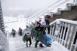 06.01.2021, Oberhof, Germany (GER): Event Feature: Japanese Team staff walk up the stairs -  IBU World Cup Biathlon, training, Oberhof (GER). www.nordicfocus.com. © Manzoni/NordicFocus. Every downloaded picture is fee-liable.