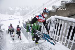 06.01.2021, Oberhof, Germany (GER): Event Feature: Japanese Team staff walk up the stairs -  IBU World Cup Biathlon, training, Oberhof (GER). www.nordicfocus.com. © Manzoni/NordicFocus. Every downloaded picture is fee-liable.