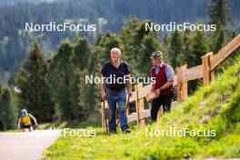 08.06.2023, Lavaze, Italy (ITA): Local workers on the skiroll track - Biathlon summer training, Lavaze (ITA). www.nordicfocus.com. © Barbieri/NordicFocus. Every downloaded picture is fee-liable.