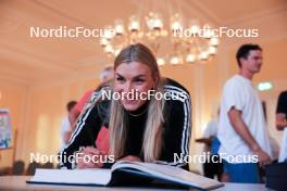 12.08.2023, Wiesbaden, Germany (GER): Hanna Kebinger (GER) signs the golden book of Wiesbaden - City Biathlon - Wiesbaden (GER). www.nordicfocus.com. © Manzoni/NordicFocus. Every downloaded picture is fee-liable.