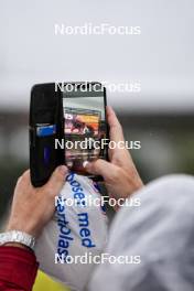 03.08.2024, Sandnes, Norway (NOR): Fan taking pictures with their smartphone Event Feature: - BLINK24 Festival Biathlon - Sandnes (NOR). www.nordicfocus.com. © Nordnes/NordicFocus. Every downloaded picture is fee-liable.