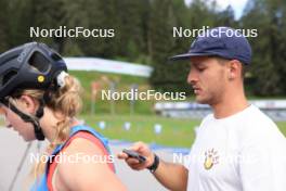 15.07.2024, Lenzerheide, Switzerland (SUI): Grace Castonguay (USA), Emil Bormetti (ITA), Coach Team USA, (l-r) - Biathlon summer training, Lenzerheide (SUI). www.nordicfocus.com. © Manzoni/NordicFocus. Every downloaded picture is fee-liable.