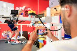 02.07.2024, Premanon, France (FRA): Emilien Jacquelin (FRA) competes through the iphone camera of Simon Fourcade (FRA) - Biathlon summer training, Premanon (FRA). www.nordicfocus.com. © Manzoni/NordicFocus. Every downloaded picture is fee-liable.