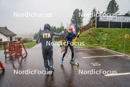 27.09.2024, Lavaze, Italy (ITA): Jonne Kahkonen (FIN), coach Team Italy, Lisa Vittozzi (ITA), (l-r) - Biathlon summer training, Lavaze (ITA). www.nordicfocus.com. © Barbieri/NordicFocus. Every downloaded picture is fee-liable.