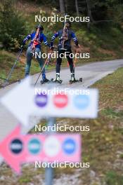 11.10.2024, Ramsau am Dachstein, Austria (AUT): Track signs lead the way for Gilonne Guigonnat (FRA), Oceane Michelon (FRA), (l-r) - Biathlon summer training, Dachsteinglacier, Ramsau am Dachstein (AUT). www.nordicfocus.com. © Manzoni/NordicFocus. Every downloaded picture is fee-liable.